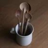 Round solid wood spoon with long handle in black walnut, cherry wood, or hard maple