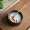 Round solid wood spoon with long handle in black walnut, cherry wood, or hard maple