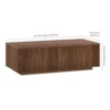 Close-up of the vertical fluted channels on the wood coffee table base
