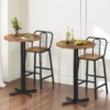 Round metal-frame bar table pair styled for a compact dining room