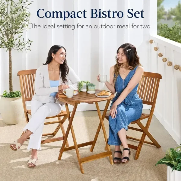 Acacia wood patio set moved to the side of a small patio to free up floor space