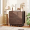 Two large drawers and two cabinets open beneath the folding dining table