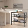 Industrial console table with shelves standing against a hallway wall