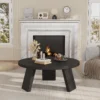 Three-leg base of the round coffee table with inclined legs on a living room rug