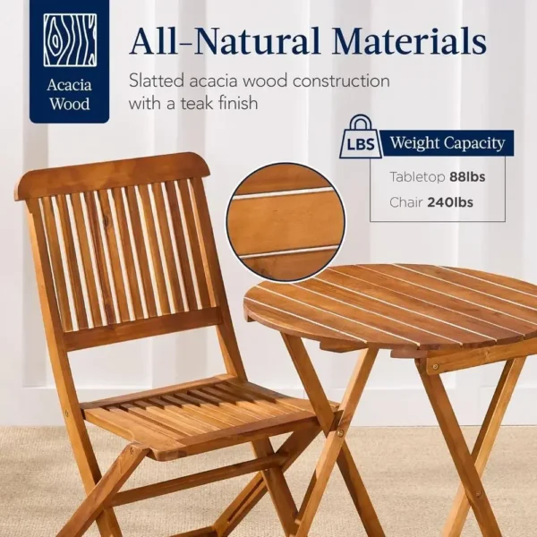 Acacia wood patio set for two on a small deck with a plant in the corner