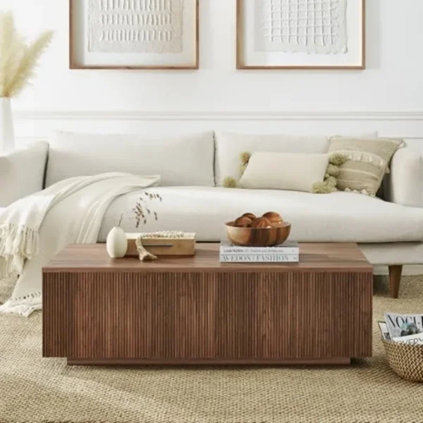 Mid century modern fluted coffee table shown in a living room beside a sofa