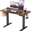 Small electric standing desk with a 45 by 24 inch desktop in a compact home office
