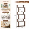 Black S-shaped geometric bookcase in a home study