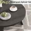 Side view of the round coffee table showing the 15.7 in height and 0.98 in thick top