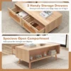 wooden-coffee-table-with-storage-rattan-3 Close-up of the woven wood pulp rattan drawer front and wooden handle in a natural finish